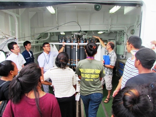 Senior resercher providing scientific mission with sea water collecting apparatus.
