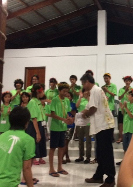Students gave the handmade flag to Mr. Kester James at Social Affairs