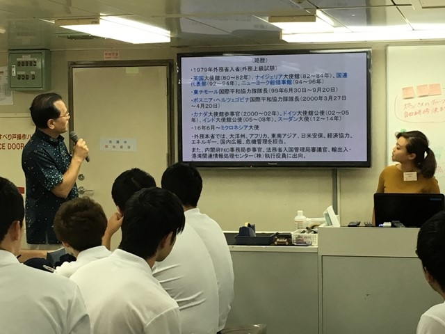Ambassador is giving a lecture to students.