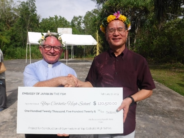 Handing over the big check