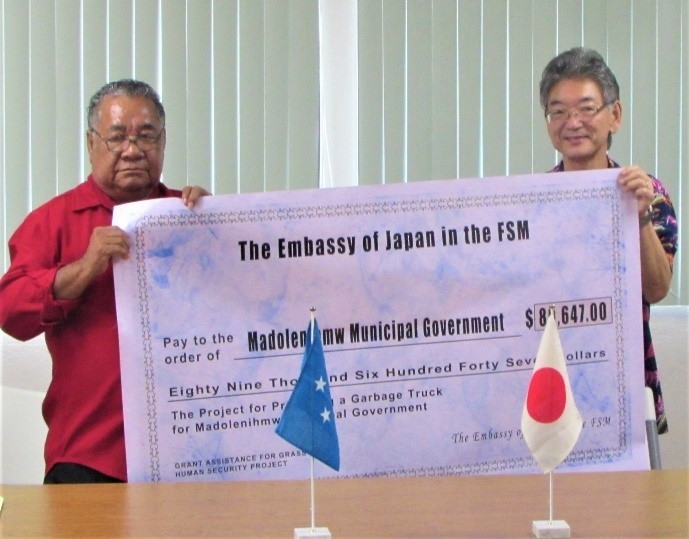 Handing over the big check